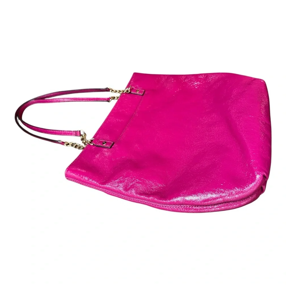 Michael Kors patent leather handbag in a sleek, glossy finish.
